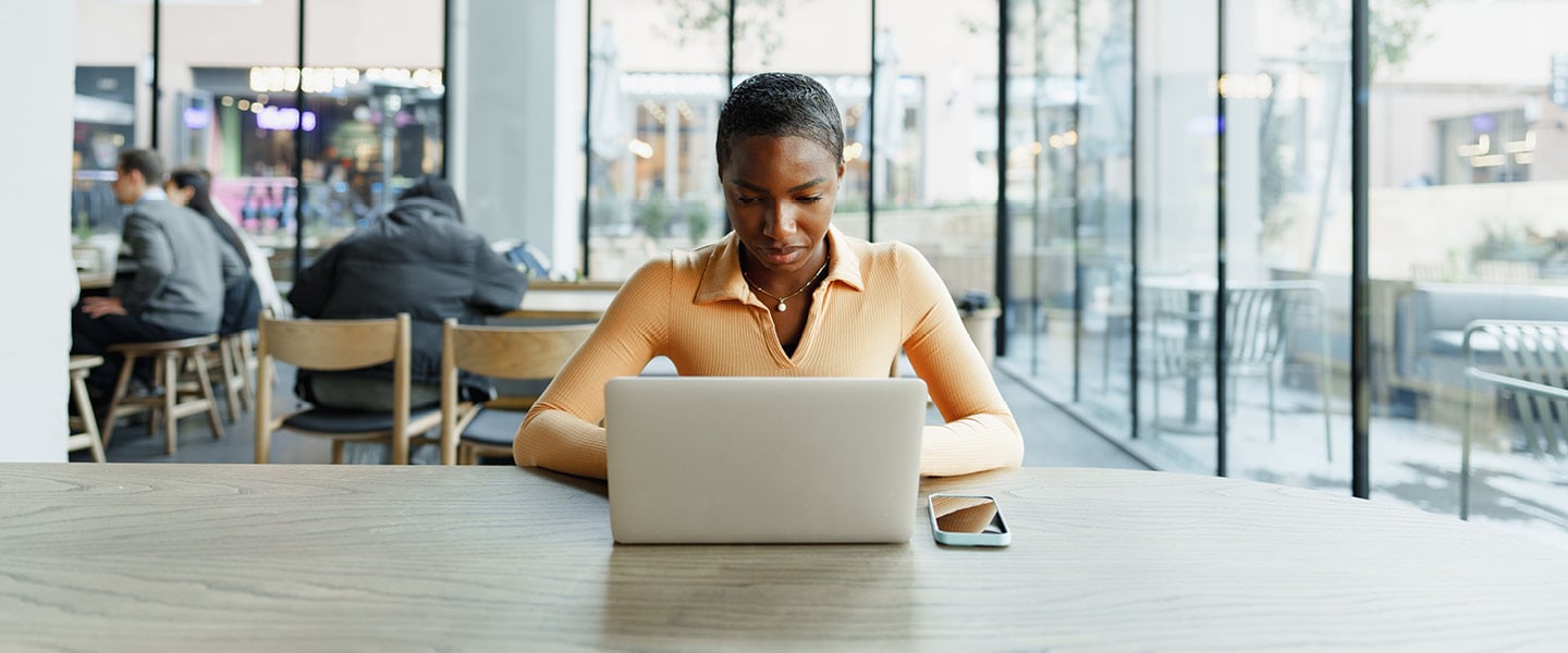 young woman working on laptop
