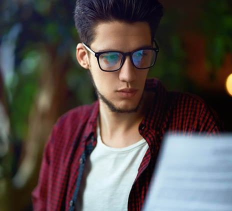 man looks at digital screen 