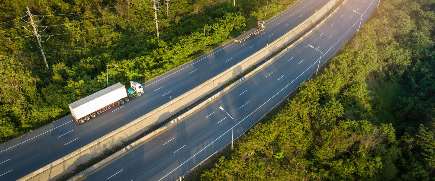 container truck with cargo trailer drives on highway