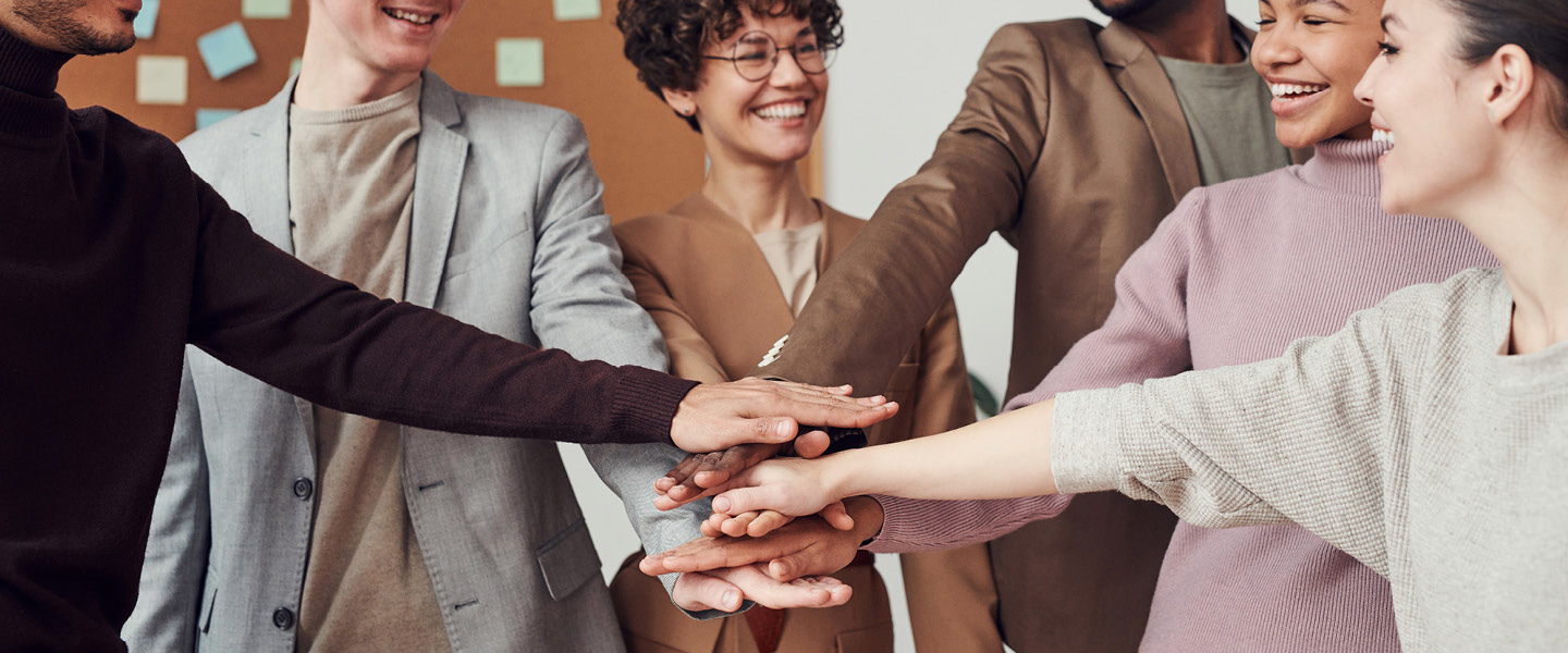 Group of people with hands together