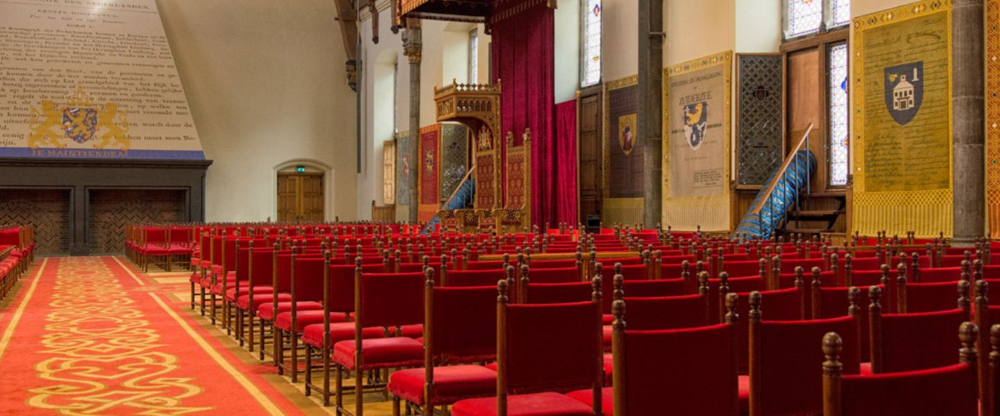 Ridderzaal in the Hague with red chairs