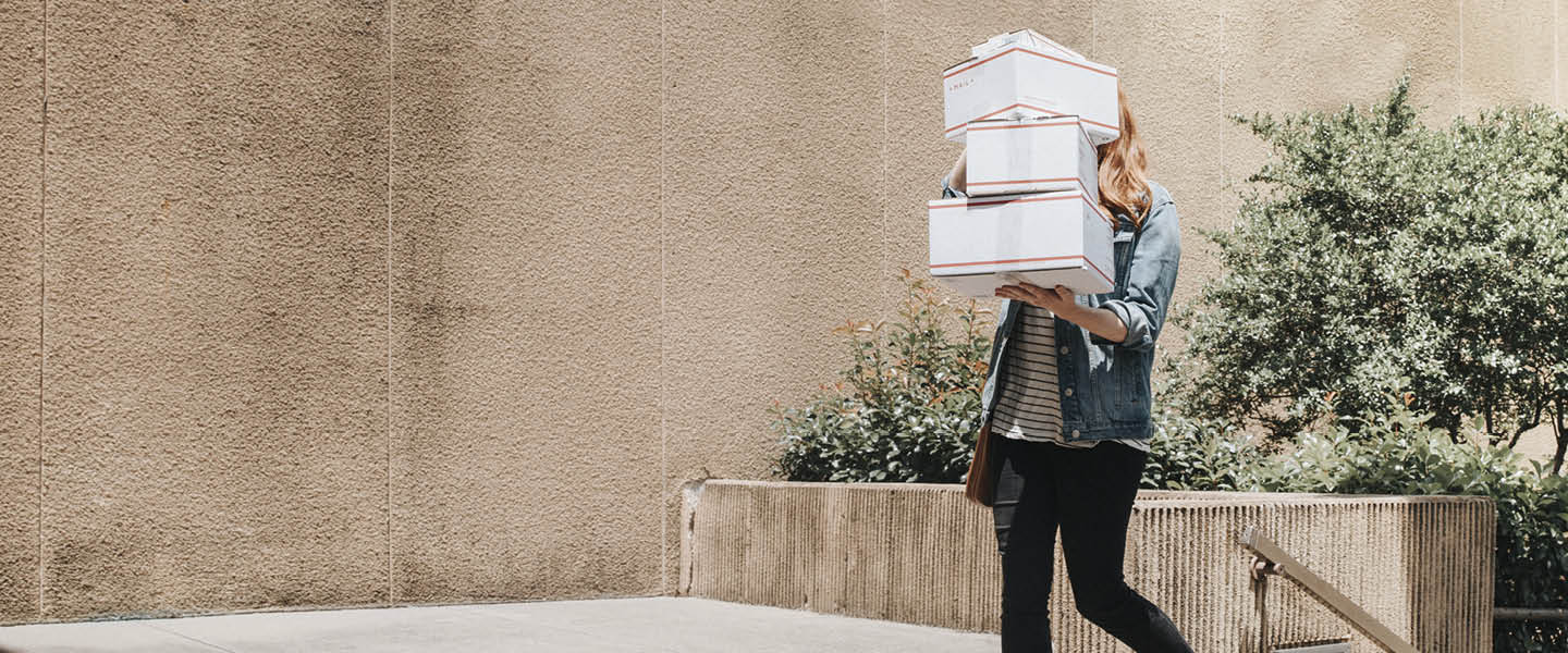 woman carrying boxes