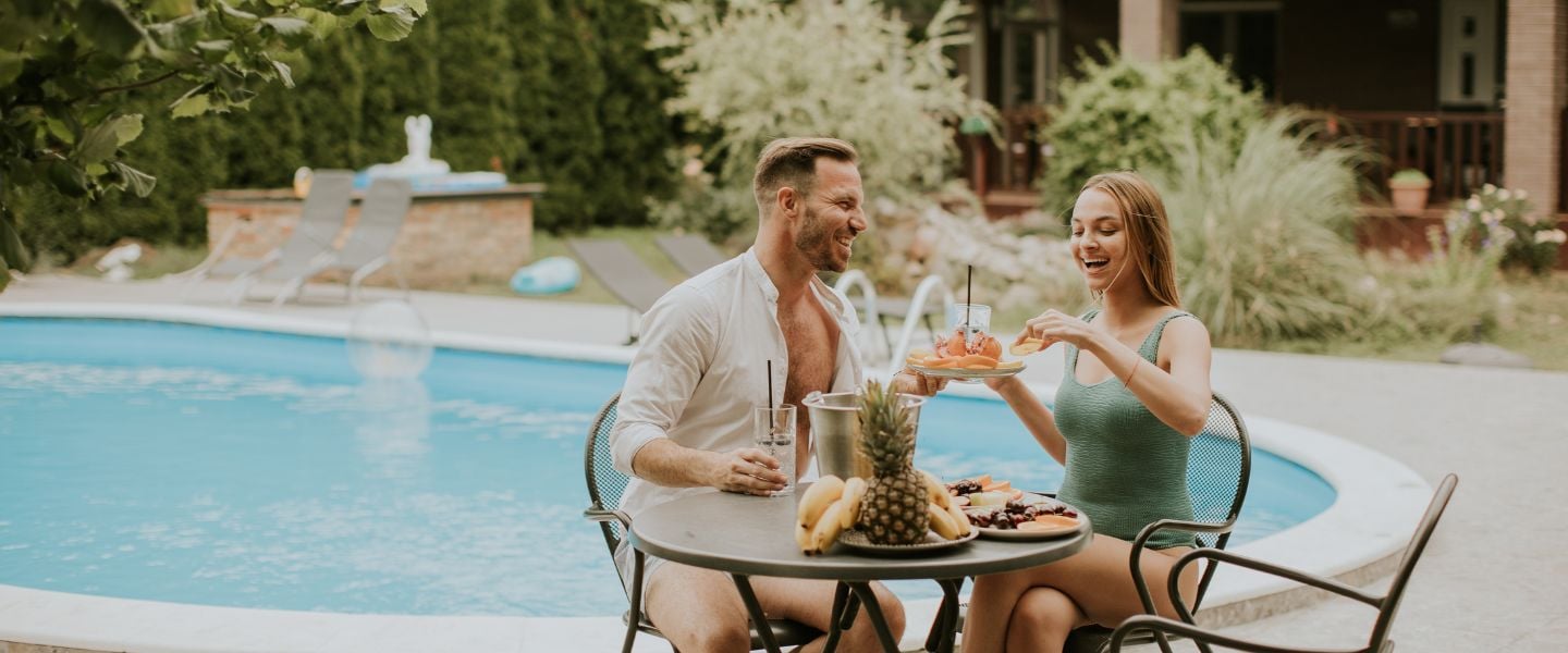 young couple sitting in the backyard