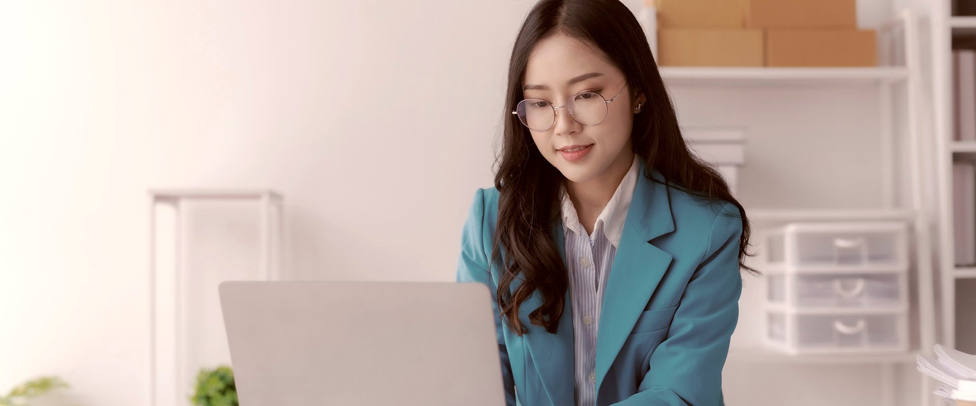 Open CVs and Open FGRs - smiling businesswoman using laptop