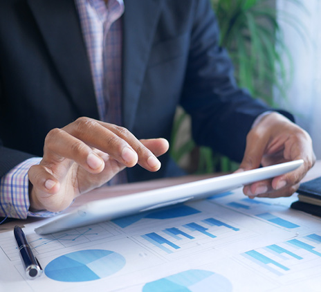 businessman using digital tablet on office desk