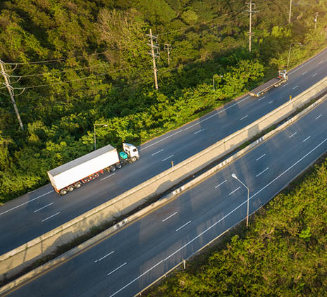 container truck with cargo trailer drives on highway