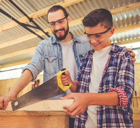 Father and son working with wood