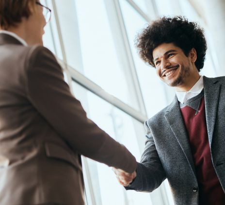 happy businessman shaking hands with woman