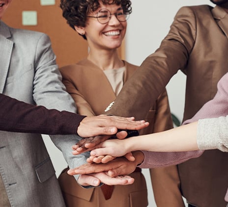 Group of people with hands together