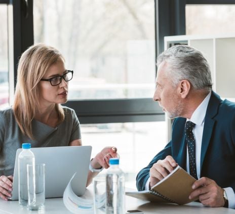 serious professional business people looking at each other