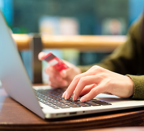 Woman using laptop for booking ticket