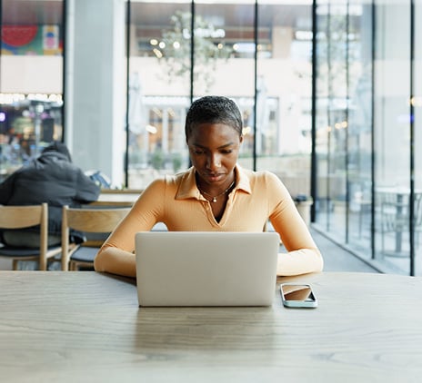 young woman working on laptop