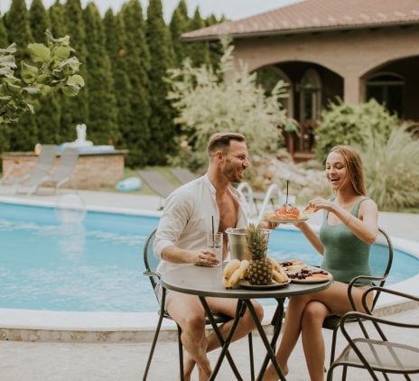 young couple sitting in the backyard