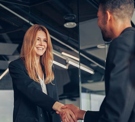 woman shakes hand with man