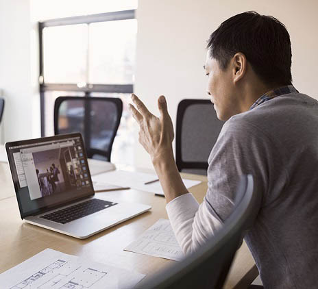 Chinese man behind laptop