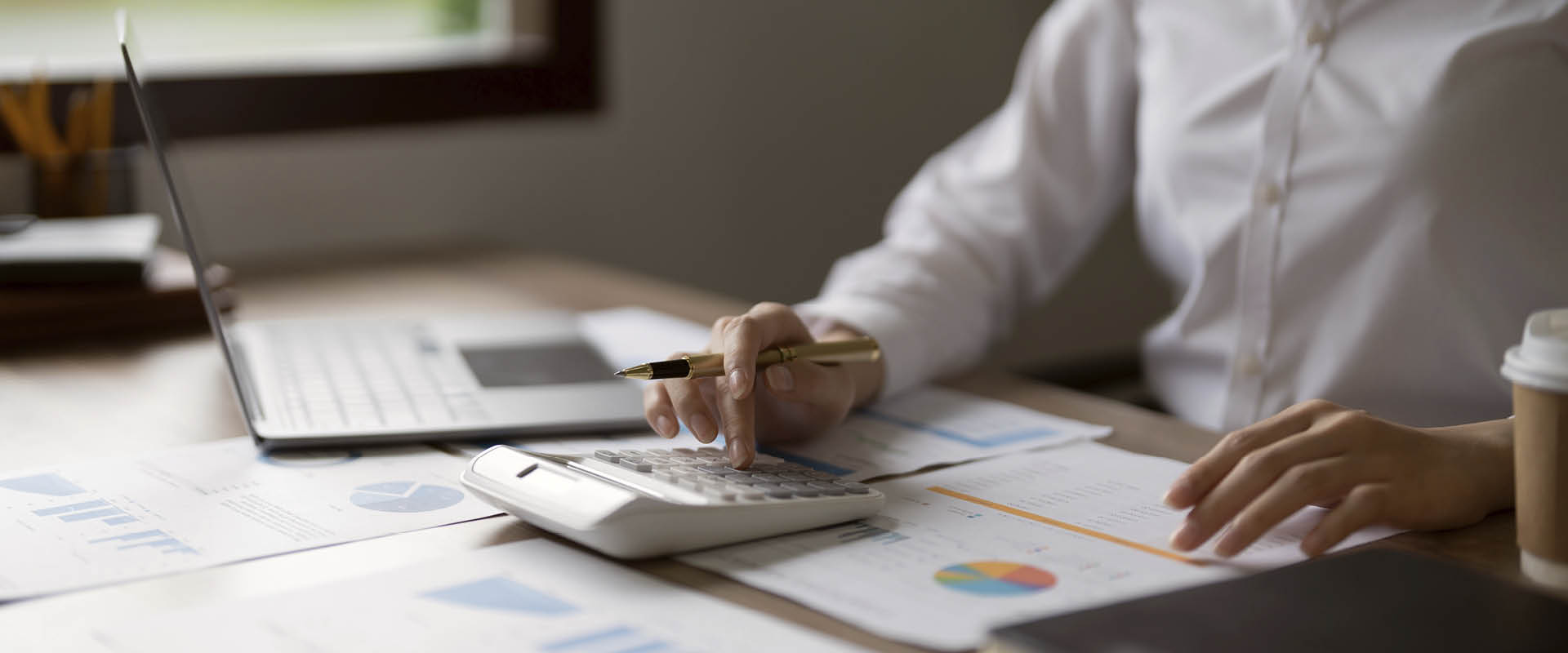 business woman using calculator