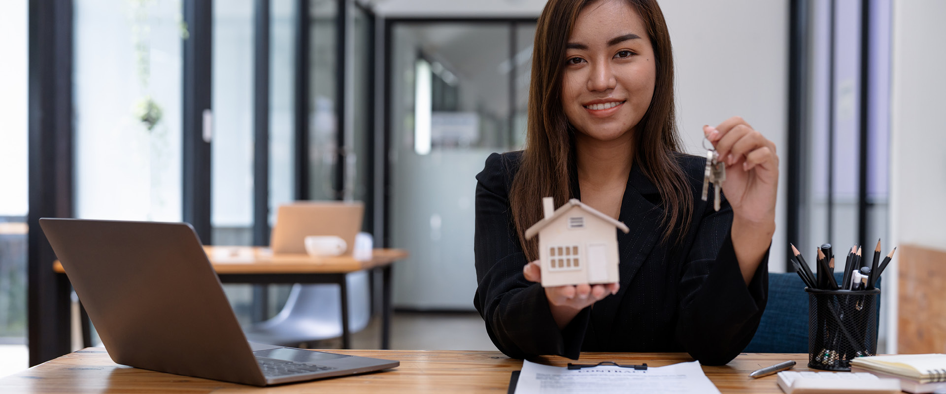 real estate agent handing over keys 